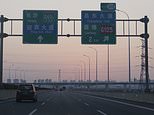 Here's what driving in China is really like - from anti-drowsiness lasers on motorways to temple toll booths