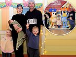 Katherine Ryan looks every inch the doting mother carrying daughter Holland in her arms as she attends Bluey Christmas event with husband Bobby Kootstra and their kids