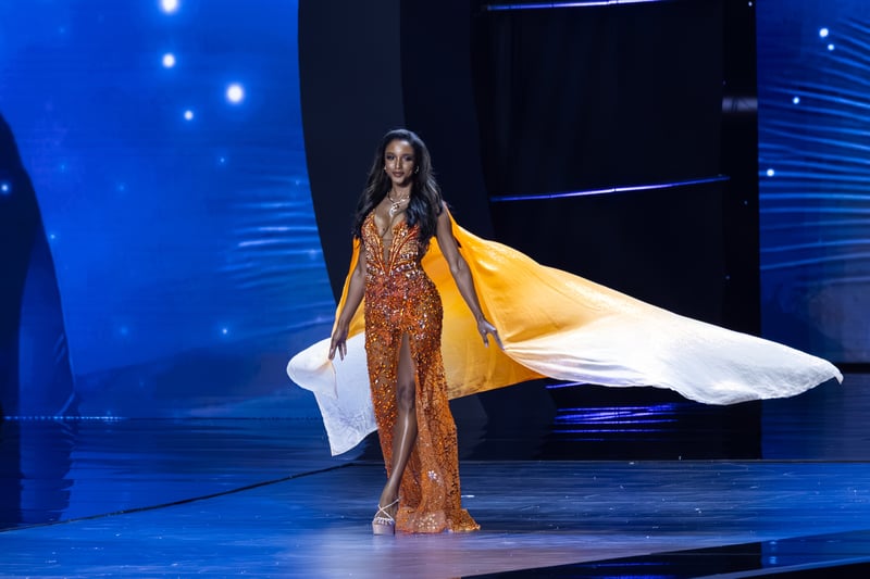 Miss Jamaica to remain hospitalized in ICU for at least another week after tumbling off Miss Universe stage