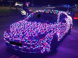 Motorist who covered his car with Christmas lights is pulled over by police - as officers warn they could 'end up on Santa's naughty list'