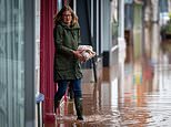 Weekend washout! Dozens of flood alerts in place across UK as Met Office issues 'danger to life' weather warning in south Wales amid heavy rainfall