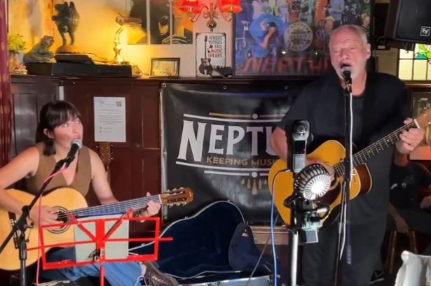 Man steps up to play at open mic night - then people realise who he actually is