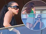 Dua Lipa and her lookalike sister Rina pose up a storm on a balcony in Rio de Janeiro ahead of her performance in the city