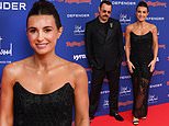 Dani Dyer puts on a glamorous display in a glitzy black sheer gown as she joins dad Danny at the Rolling Stone UK Awards