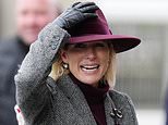 Zara Tindall holds onto her hat as she leads racegoers braving blustery and wet weather at Cheltenham amid Storm Claudia amber weather warning