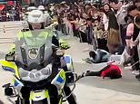 Motorcycle cop crashes into crowd sending children FLYING before checking on her bike