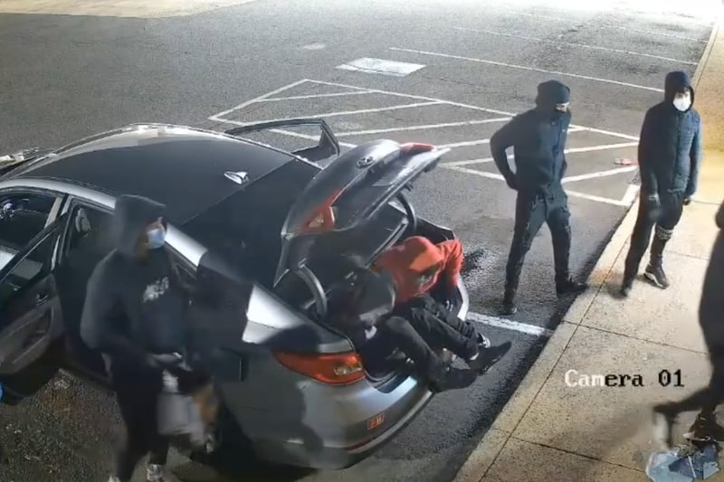 9 thieves embrace their inner clowns as surveillance footage shows them all climbing out of tiny car before vape shop heist