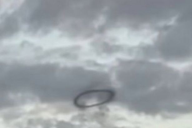 Disneyland UFO theory as mysterious 'black ring' spotted hovering over park