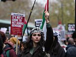 Thousands of Pro-Palestinian protesters chant 'Israel is a terrorist state' as they march through central London while police look on