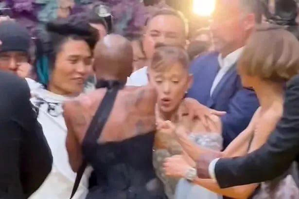Ariana Grande grabbed in shocking scenes at Wicked premiere as Cynthia leaps into action