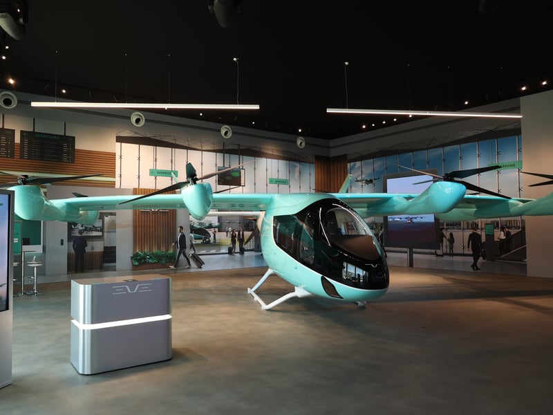 Flying taxi CEO said Embraer's yet-to-fly aircraft will soar over traffic by 2027 and eventually be pilotless. Meet Eve.