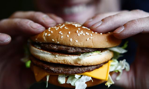 Man, 22, fights for life after swallowing a whole burger without chewing it 'for a joke'